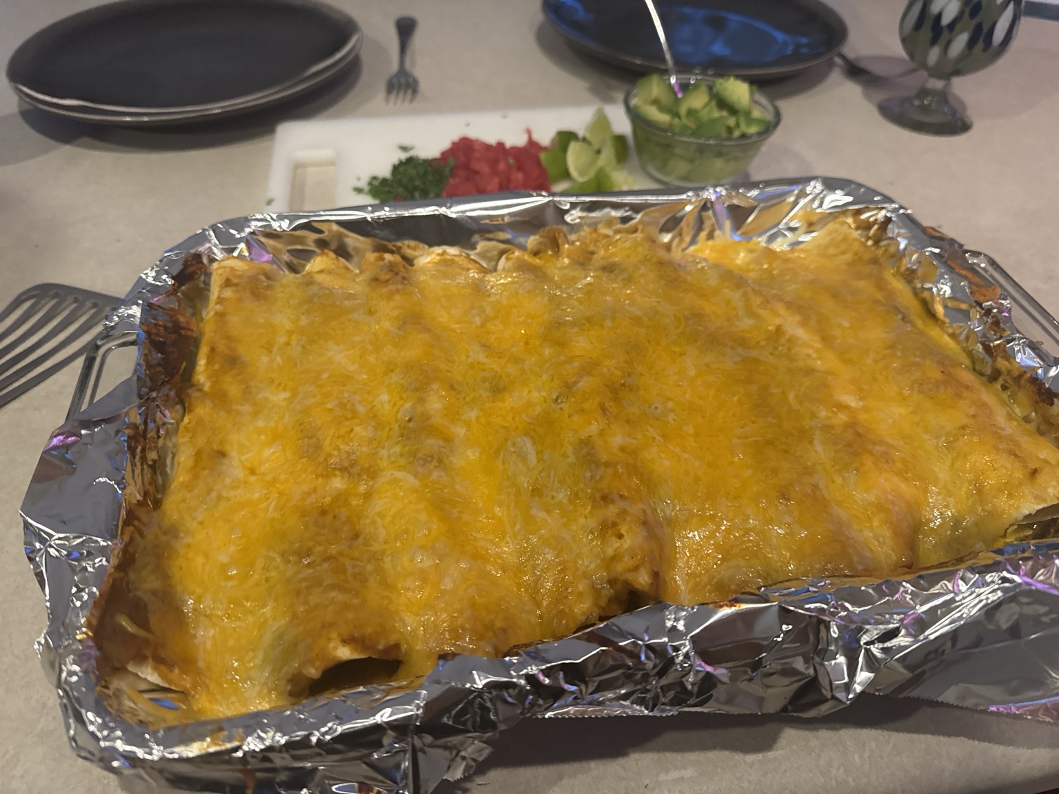 Finished pan of baked smoked chicken enchiladas with melted cheese