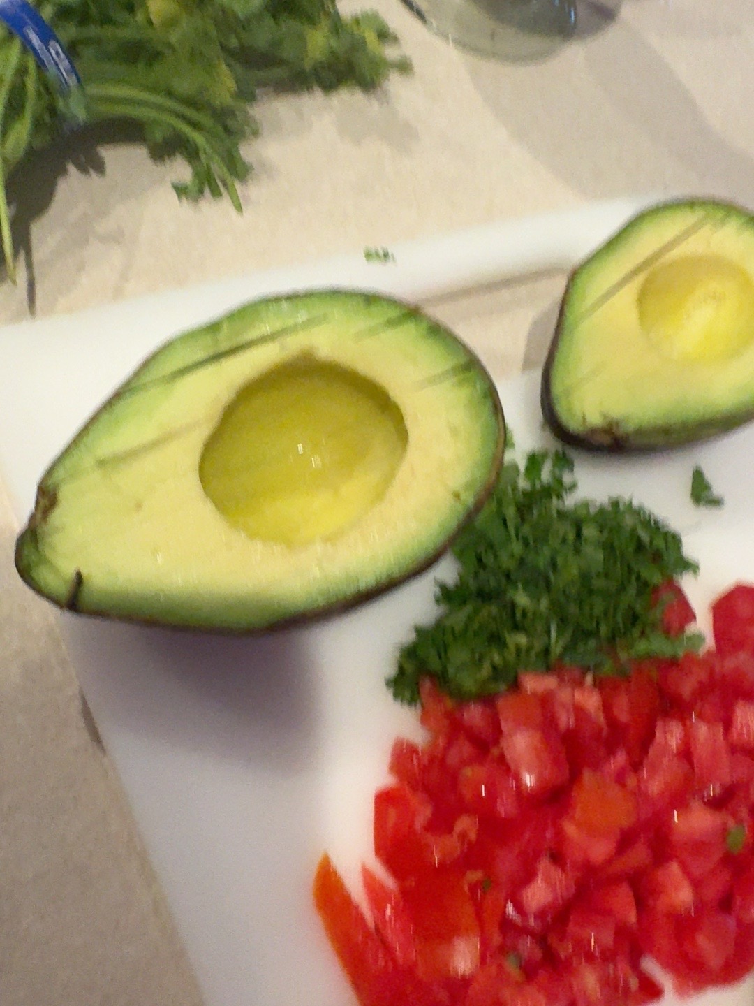 Fresh avocado, tomato and cilantro toppings for smoked chicken enchiladas