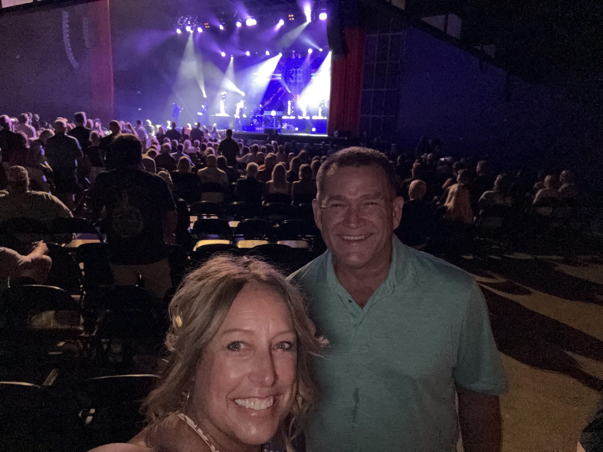 Our selfie at the .38 Special concert with the stage behind us