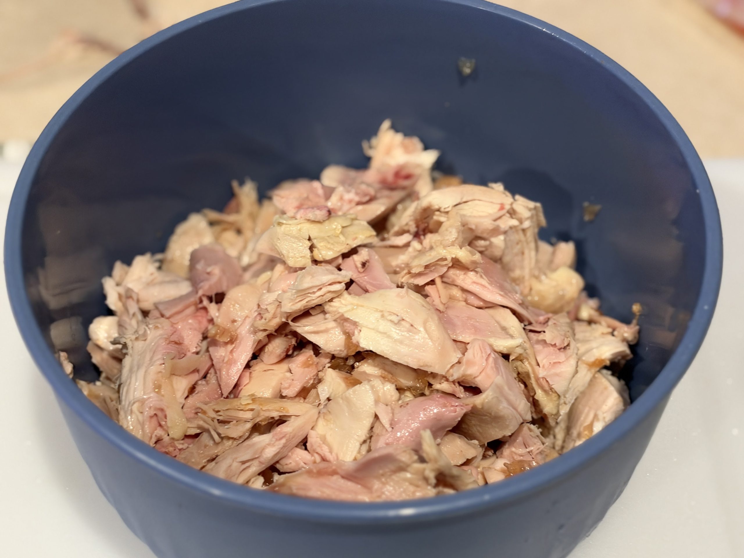 Pulled rotisserie chicken ready to be seasoned for fajitas