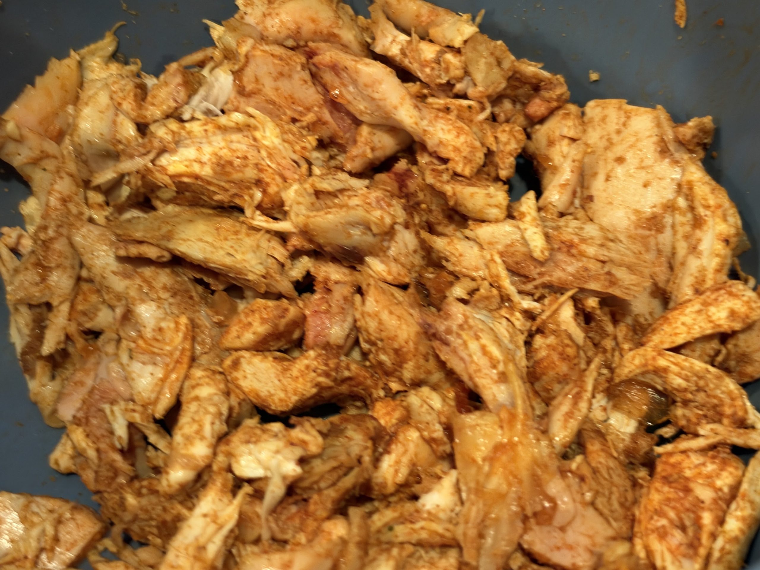 Pulled rotisserie chicken seasoned with cumin, smoked paprika and bouillon