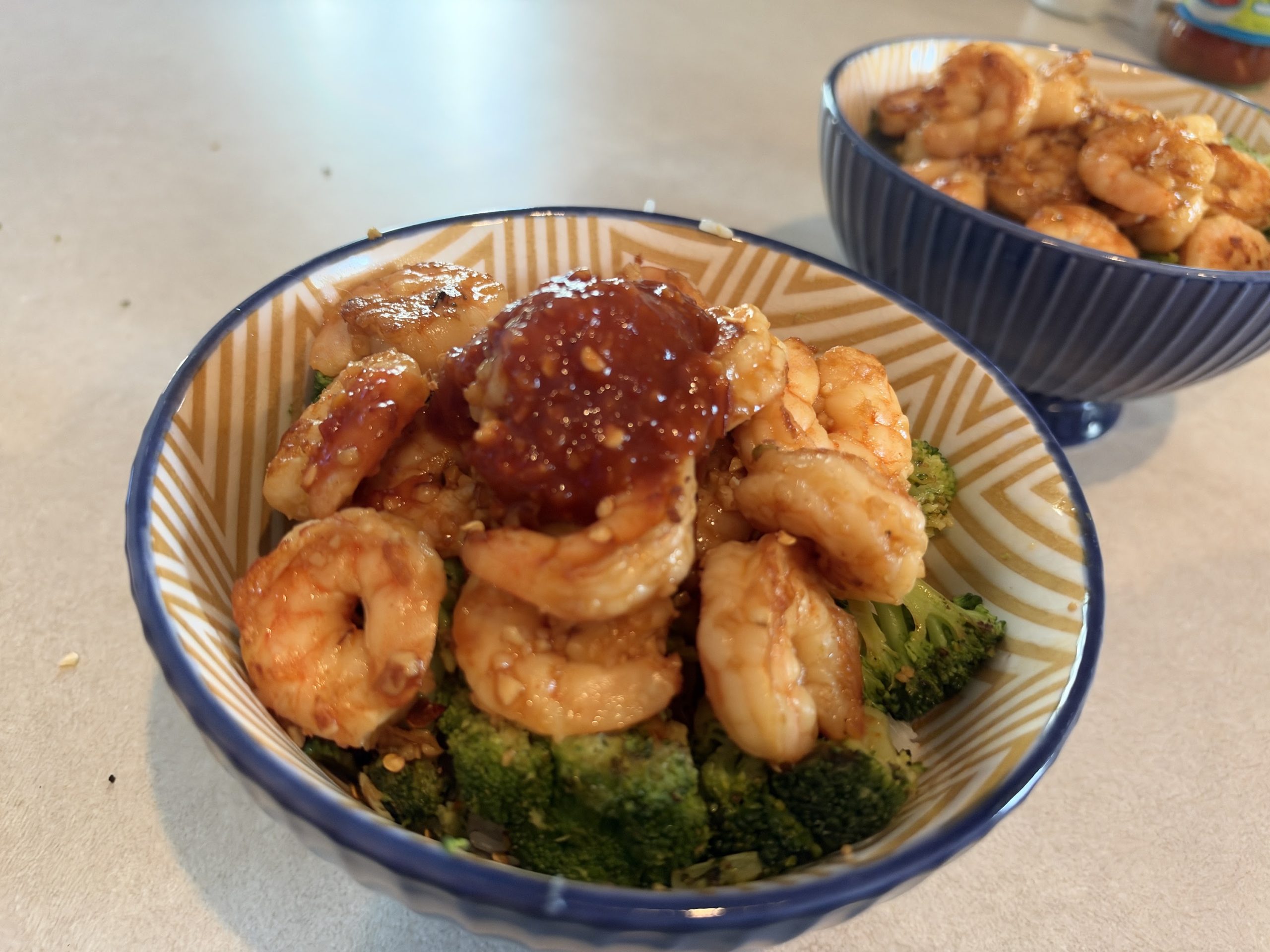 Finished sweet spicy shrimp and broccoli bowl