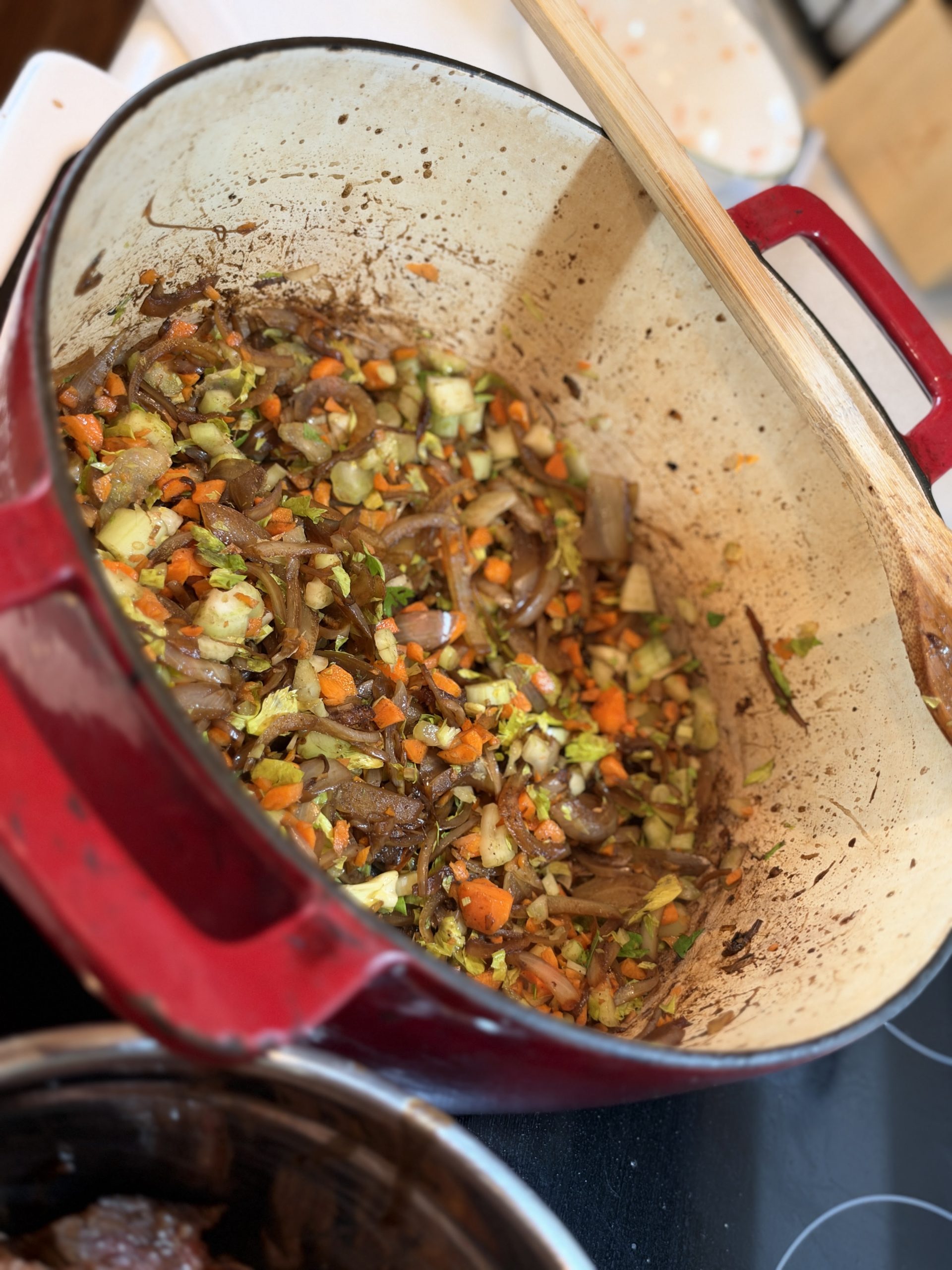 Carrots and celery stirred into the deeply browned onion base
