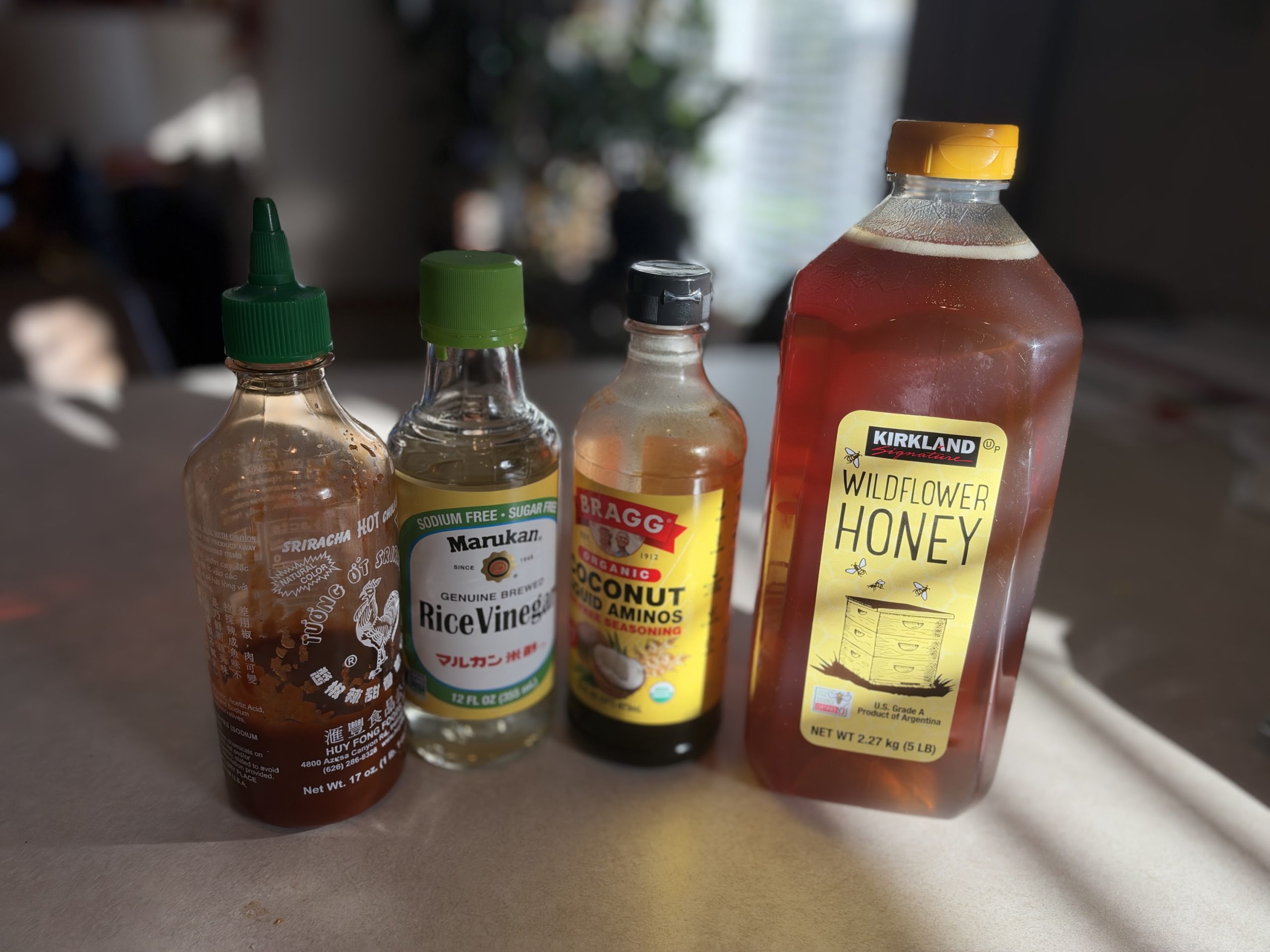 The honey, coconut aminos, vinegar and Sriracha for the sauce